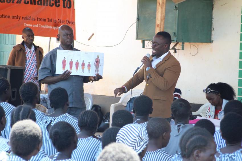 Daniel Karanja talking about menstruation in a school