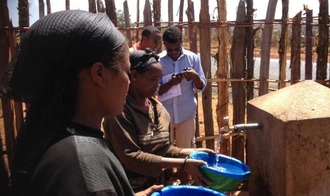 Monitoring with a smartphone in Ethiopia. Photo: IRC