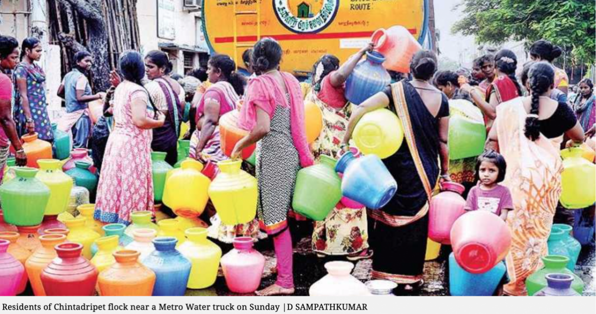 Residents of Chintadripet flock around a water truck (D. Sampathkumar)