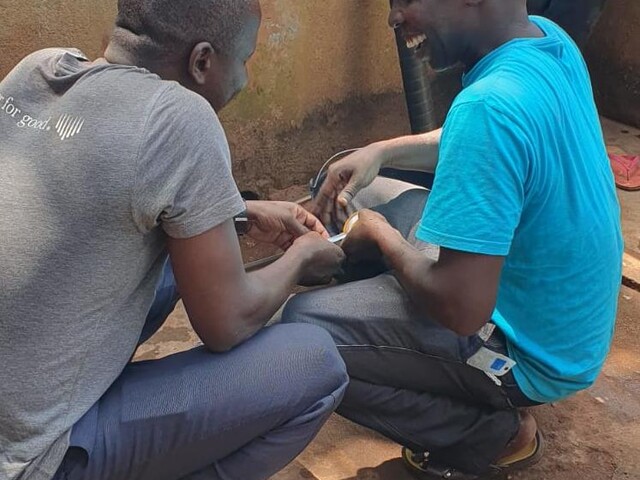 Circuit rider Fabien (right) getting to grips with the Vergnet pump, Central African Republic