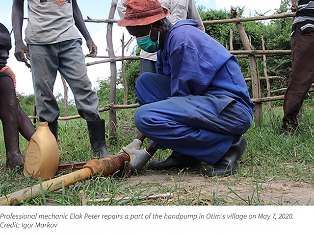 Professional mechanic repairs village handpump in Uganda