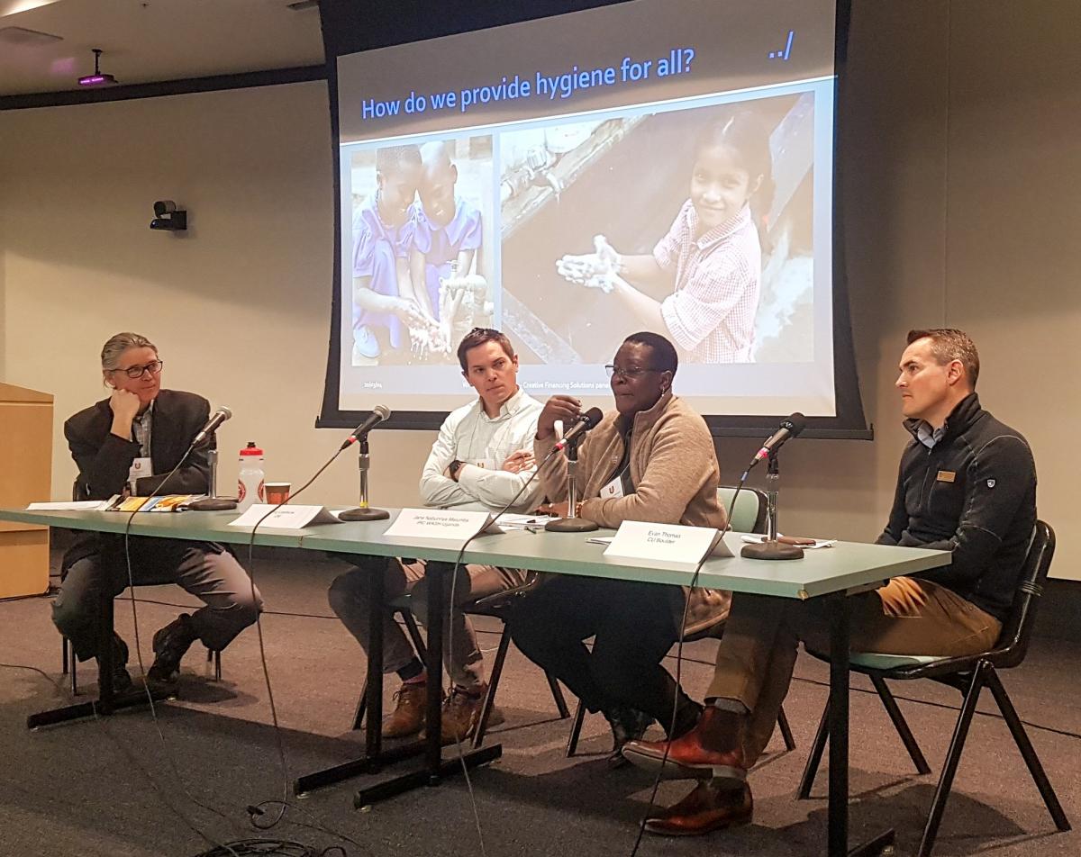 Four people at a panel presentation